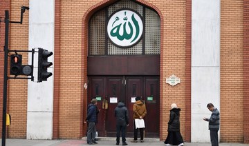 Muslims can be seen outside the East London Mosque in London, England. (File/AFP)