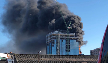 A crane operator has rescued a man from a burning high-rise in England