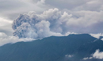 Volcanic ash spews from Mount Marapi during an eruption as seen from Tanah Datar in West Sumatra on December 3, 2023. (AP)